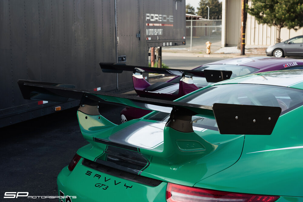 Designer Engineering – We offer a variety of options from top level engineers to offer our clients the best. The team at Savvy continually develop the highest quality aero options that not only create a balanced aero package, but stay true to the Porsche design & elegance our clients demand. Specializing in Porsche 991 GT3 & 991 GT3 RS bolt on wing packages, with additional Porsche variants to come. mechanic working on exhaust