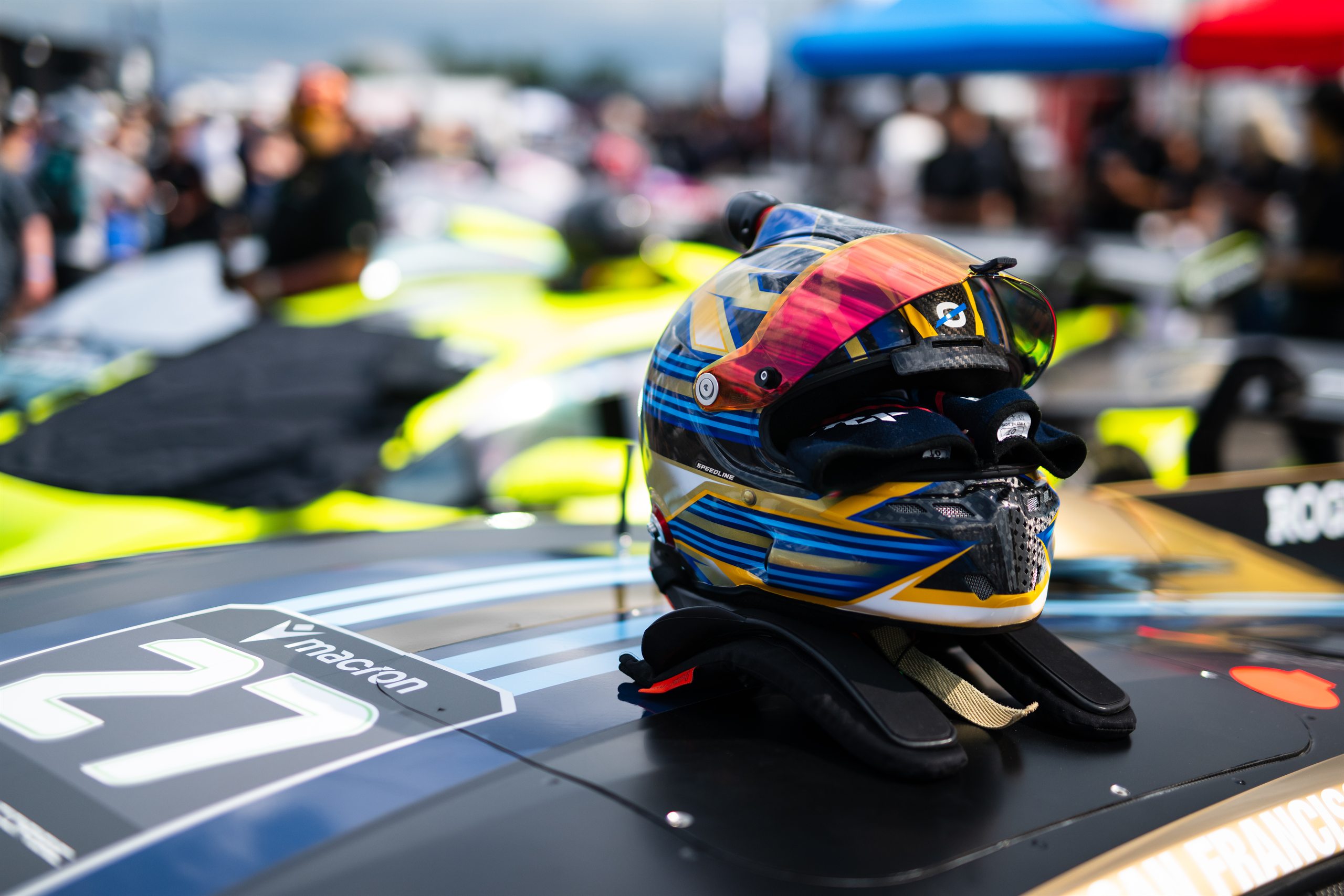 Driver helmet resting on the SP Motorsports #27 Lamborghini Super Trofeo